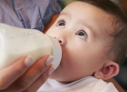 Baby drinking infant formula 