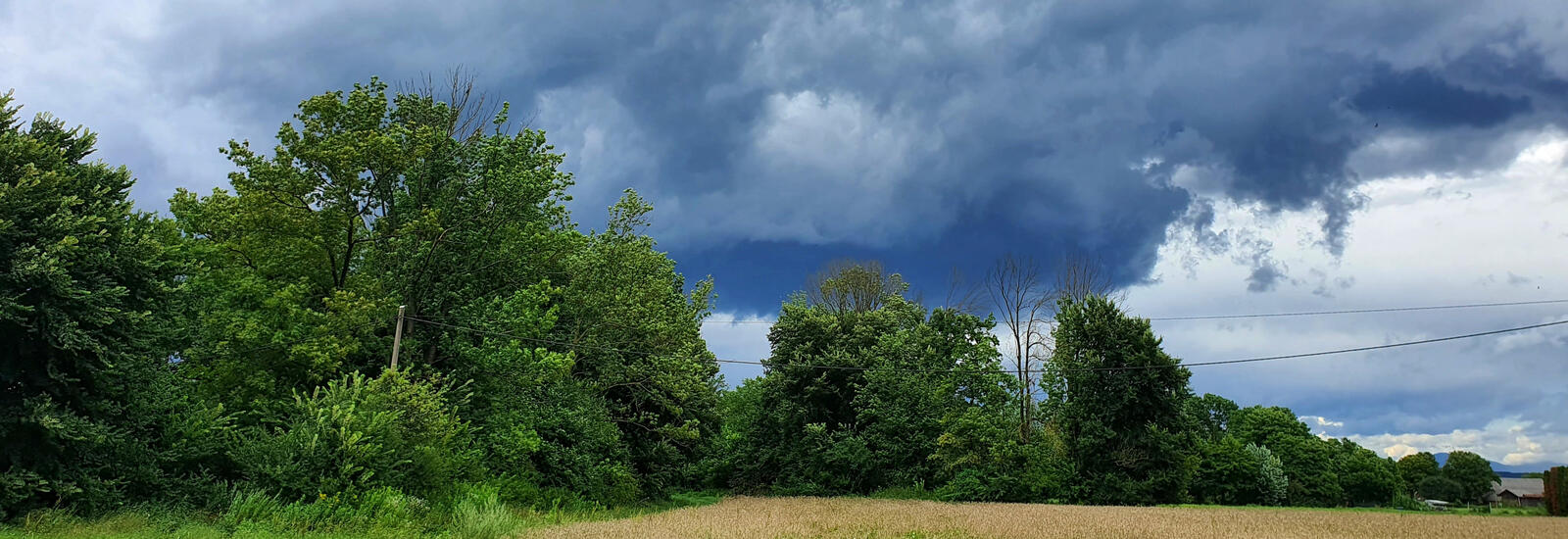 Storm clouds over a farm.