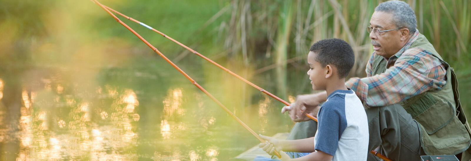 Grandfather and child fishing. 