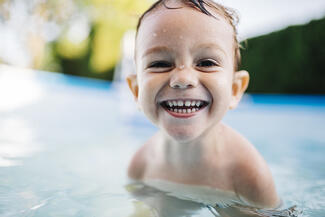 smiling child in pool
