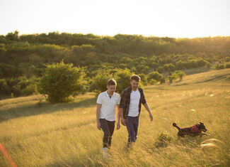 IMM_ID_two-Men-Walking-hillside_S.jpg