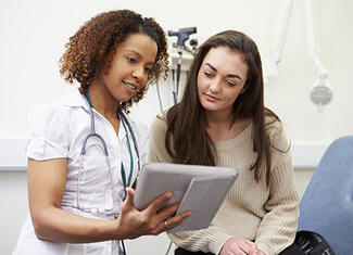 Teenager and medical provider talking