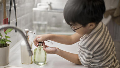 child washing hands