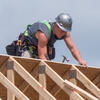 man building roof