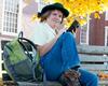 smiling person on bench