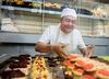 man baking cupcakes