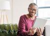 woman looking at tablet