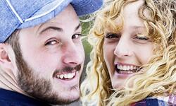 two young people, smiling