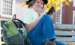 smiling person on bench