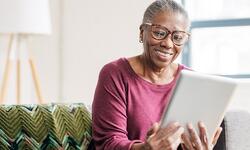 woman looking at tablet